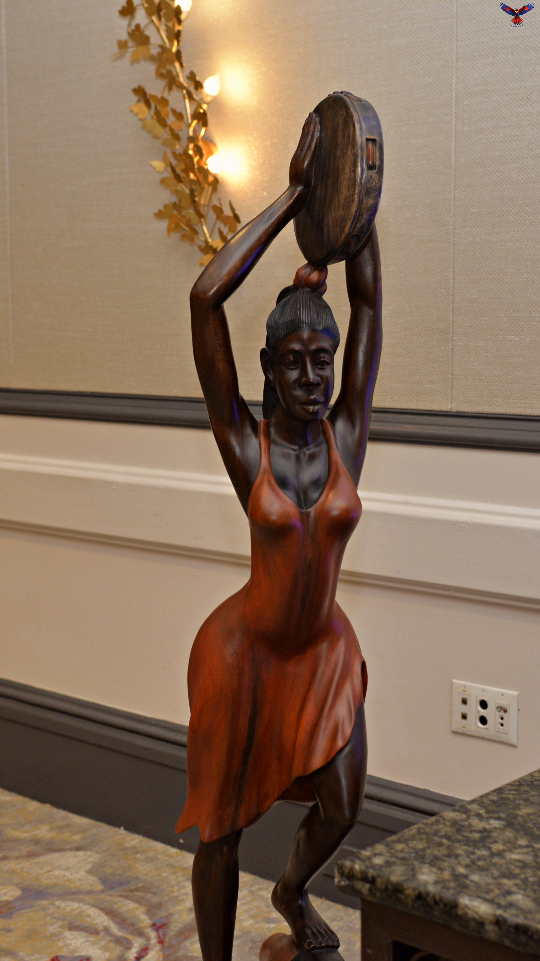 She shakes light into the air—rhythm for the soul, movement for the ancestors.