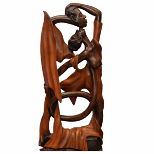 Hand-carved Haitian wood sculpture “Riban nan Nou” showing intertwined couple in flowing ribbon design.